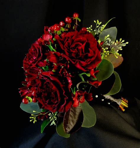 Black magic roses bouquet with greenery